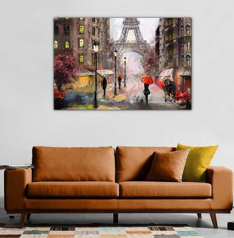 May include: A painting depicting a Parisian street scene with the Eiffel Tower in the background. The street is lined with buildings and streetlights, and people are walking under red umbrellas. The painting is executed in a painterly style with an emphasis on light and shadow.