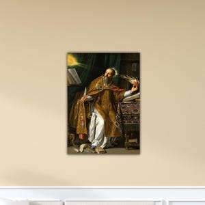 May include: A framed print of a classical painting depicting a robed figure with a beard, holding a quill and a dove. The figure is seated at a table with books, with a light source emanating from above. The color palette includes gold, brown, and white.