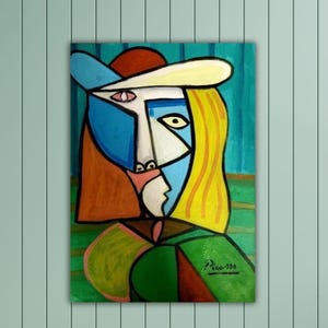 May include: A cubist style painting of a woman with a yellow hat and a blue and white face. The background is a teal blue with green and yellow stripes. The painting is signed "Picasso 220".