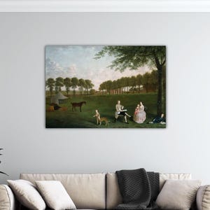 May include: A framed print of a pastoral scene. The artwork depicts a group of people and animals in a field with trees and a tent. A man and woman are seated, while others are standing or lying down. A horse and dog are also present.
