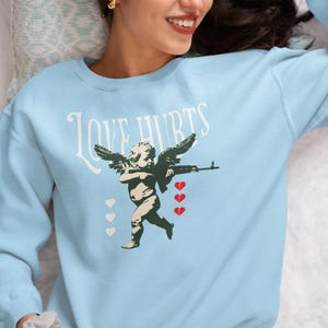 Love Hurts Cupid Sweatshirt, Valentine&#39;s Day Heart Shirt, Unisex Sweat, Crewneck Jumper, Valentine&#39;s Gift, Heart Graphic Top