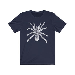 May include: A navy blue t-shirt with a white graphic of a spider.
