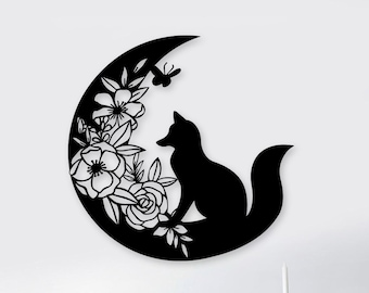 May include: Black metal wall decor featuring a crescent moon with a fox sitting on it, surrounded by floral designs.