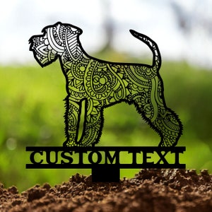 May include: Black metal silhouette of a Schnauzer dog with intricate floral patterns. The silhouette is mounted on a metal stake with the text "CUSTOM TEXT" below.