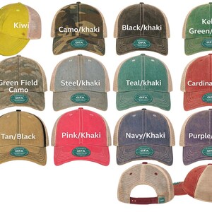 a collection of various colored and patterned baseball caps, each with a different label indicating the color or pattern.