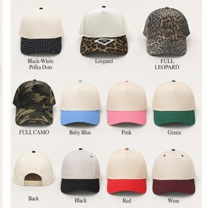 a collection of various baseball caps in different colors and patterns, including black and white polka dots, leopard print, full camo, baby blue, pink, green, back, black, red, and wine.