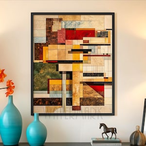 May include: Abstract geometric art print in a black frame. The artwork features a collage of rectangular and square shapes in shades of red, yellow, brown, and beige. The print is displayed on a cream-colored wall, with turquoise vases and orange flowers in the foreground.
