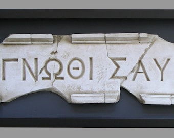 Relief inscription "Know thyself", made of reconstituted marble. 68 x 25 cm.