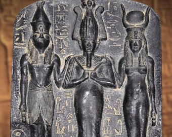 Reproduction of the divine triad, Osiris, Isis, and Horus. 40 cm. Molded marble. Reproductions of Egyptian Art