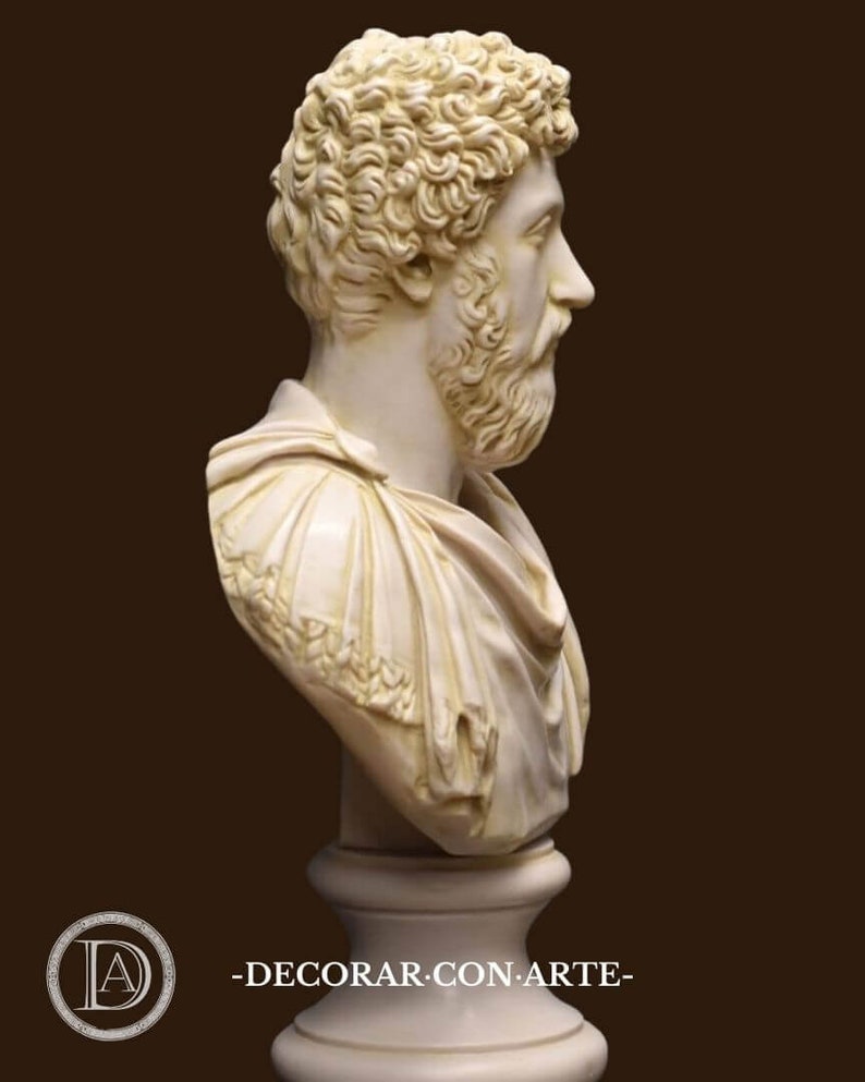 May include: A white plaster bust sculpture of a man with a beard and curly hair. The bust is on a white pedestal.