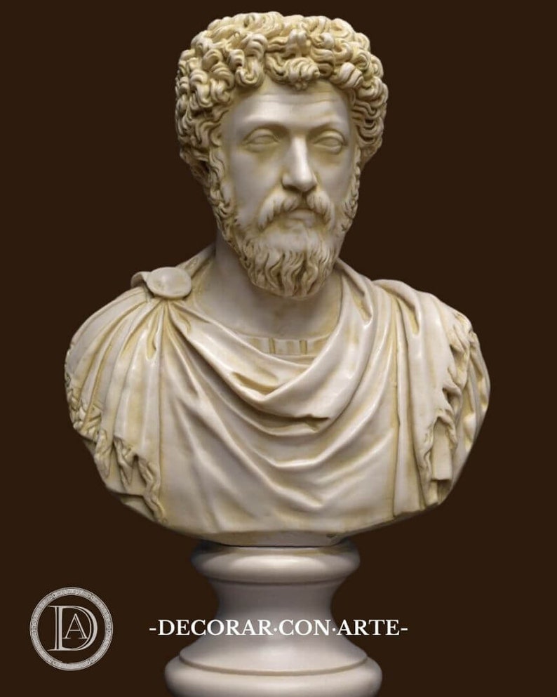 May include: A white marble bust sculpture of a man with a beard and curly hair. The bust is on a white pedestal.