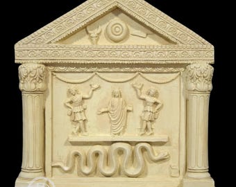 May include: Off-white relief sculpture depicting a classical temple facade. The sculpture features columns, a pediment with a bull's head, and figures in classical attire. A serpent is carved at the base. The text "DECORAR CON ARTE" is at the bottom.