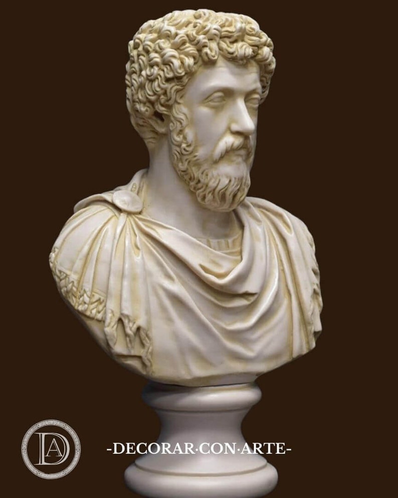 May include: A white marble bust sculpture of a man with curly hair and a beard. The bust is on a white pedestal.