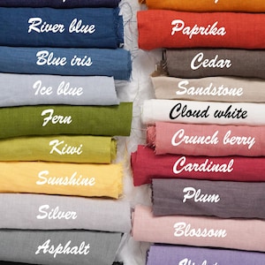 May include: A collection of fabric swatches in various colors, including blue jean, river blue, blue iris, ice blue, fern, kiwi, sunshine, silver, asphalt, coal black, mango, paprika, cedar, sandstone, cloud white, crunch berry, cardinal, plum, blossom, and violet.