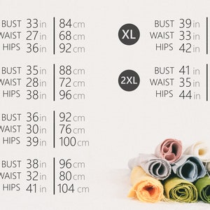 May include: Size chart with measurements in inches and centimeters for XS, S, M, L, XL, and 2XL sizes. The chart shows bust, waist, and hip measurements.