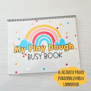 May include: A colorful play dough busy book with a rainbow and clouds on the cover. The book has 16 activity pages and is personalized and laminated.