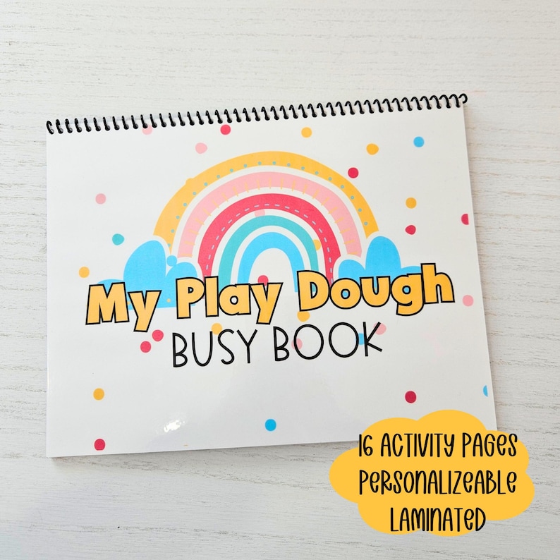 May include: A colorful play dough busy book with a rainbow and clouds on the cover. The book has 16 activity pages and is personalized and laminated.