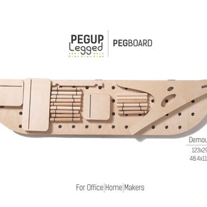 May include: A wooden pegboard with a curved shape and a set of wooden pegs. The pegboard is labelled "PEGUP Legged PEGBOARD" and "For Office | Home | Makers". The pegboard is 123 cm by 29 cm.