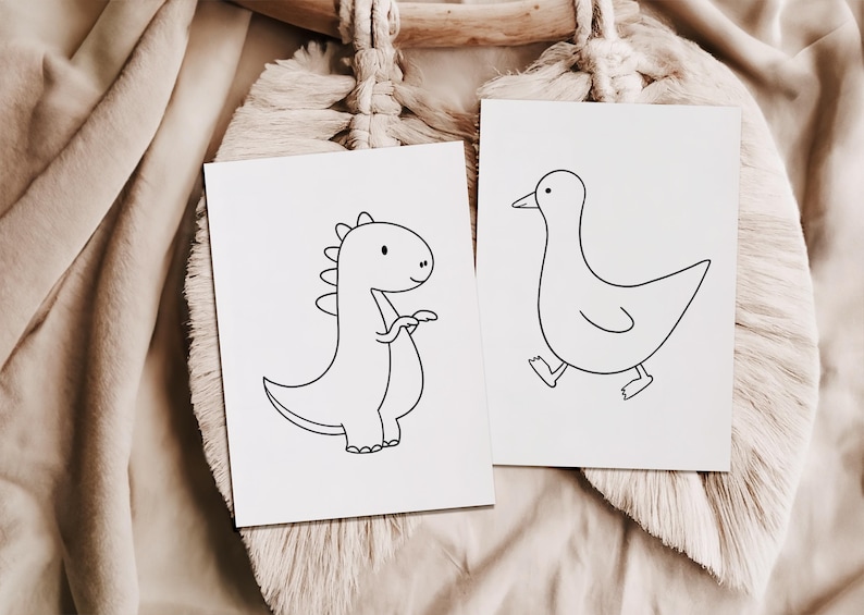 Two printable coloring pages featuring a dinosaur and a goose displayed on a beige blanket. Perfect for toddlers, preschoolers, kindergarten, and young kids.