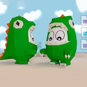 Puede incluir: Dos dinosaurios de papel verde con ojos blancos y detalles rojos. El dinosaurio de la izquierda tiene cola y el dinosaurio de la derecha tiene un cuerpo redondeado.