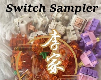 May include: A collection of mechanical keyboard switches in various colors, including white, orange, and purple. The text "Switch Sampler" is displayed at the top of the image.