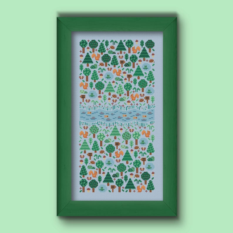 Folk cross stitch chart consisting in different types of trees and forest animals (squirrels, frogs, hedgehogs) arranged on a rectangle shape with a river crossing in the middle. The colors are natural, mainly green, blue and brown with a touch of red and orange. Stitched on sky blue Aida.