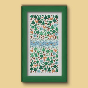 Folk cross stitch chart consisting in different types of trees and forest animals (squirrels, frogs, hedgehogs) arranged on a rectangle shape with a river crossing in the middle. The colors are natural, mainly green, blue and brown with a touch of red and orange. Stitched on white Aida.