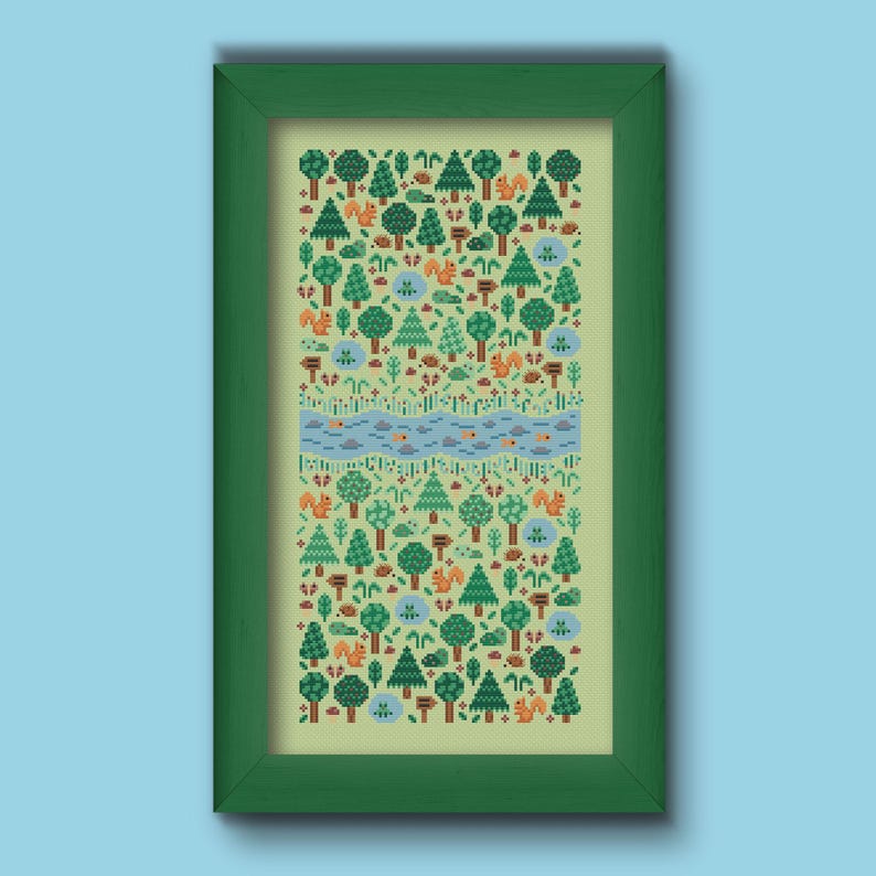 Folk cross stitch chart consisting in different types of trees and forest animals (squirrels, frogs, hedgehogs) arranged on a rectangle shape with a river crossing in the middle. The colors are natural, mainly green, blue and brown with a touch of red and orange. Stitched on light green Aida.