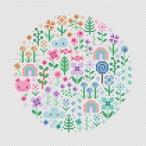 Cross stitch pattern of a kawaii themed design. The cross stitch design consists on flowers, leaves, rainbows, candy, clouds and a pink bear arranged in a round shape. The art style is cute and kawaii. The colors of the design are pastel, mainly orange, pink, purple, blue and teal. This cross stitch design is modern, minimalist and colorful. Stitched on white Aida fabric. Available to download as a cross PDF stitch pattern.