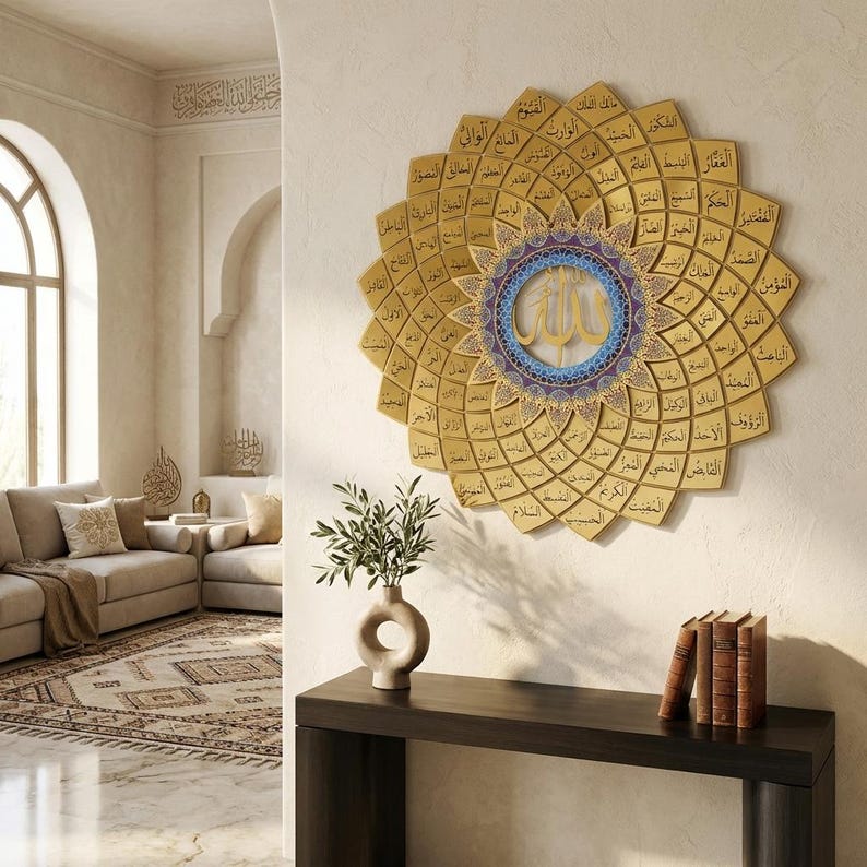 May include: A large, gold-colored wall art piece with a geometric design and Arabic script. The central design features a blue and gold circular pattern with Arabic calligraphy. The art is displayed in a well-lit room with a neutral color palette.