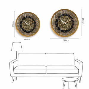 May include: Two round wall clocks with gold frames and black faces. The larger clock is 25 inches in diameter and the smaller clock is 19 inches in diameter. Both clocks feature Arabic numerals and intricate gold designs.