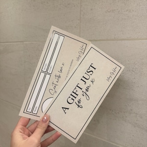 May include: Two beige gift certificates with black text. One reads "A GIFT JUST for you x" and "Sent with love x". The certificates have space for "TO", "FROM", "SIGNED", and "EXPIRY". The brand name "Mary Of Hair" is also visible.