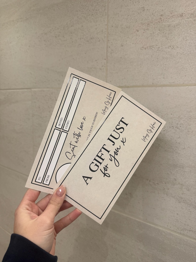 May include: Two beige gift certificates with black text. One reads "A GIFT JUST for you x" and "Sent with love x". The certificates have space for "TO", "FROM", "SIGNED", and "EXPIRY". The brand name "Mary Of Hair" is also visible.