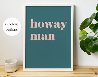 May include: A framed print with a teal background and the text "howay man" in pink.