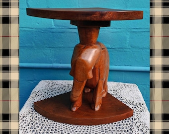 Mesa auxiliar de centro esquinera con soporte para plantas, tallada a mano en madera dura con forma de elefante.