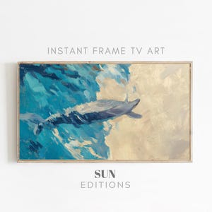 Könnte beinhalten: Ein gerahmter Kunstdruck mit einer abstrakten Malerei eines Wals in blauem Wasser. Das Kunstwerk hat einen strukturierten Pinselstrichstil mit Blau-, Weiß- und Beigetönen. Der Text "INSTANT FRAME TV ART" und "SUN EDITIONS" sind sichtbar.