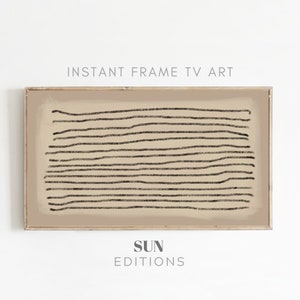 May include: A framed print with a beige background and black lines. The print has the text "SUN EDITIONS" at the bottom.