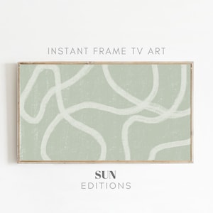 Puede incluir: Una impresión de arte abstracto enmarcada con un fondo verde salvia y líneas blancas. La impresión tiene el texto "SUN EDITIONS" debajo de la imagen.