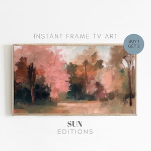 Puede incluir: Pintura abstracta de una escena de bosque con árboles rosas, marrones y verdes. La pintura tiene un ambiente suave y de ensueño y está enmarcada en un marco de madera claro. El texto "SUN EDITIONS" está impreso debajo de la pintura.