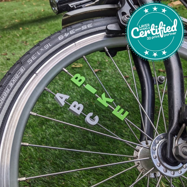 Bicycle spoke decoration: letters, numbers and symbols in many colors! Bicycle accessories, the perfect gift for a new bike.
