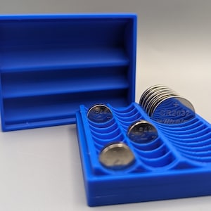 Pocket-sized button cell storage organizer. Self-closing battery box for all common button cells: LR41/44; CR2016/2025/2032