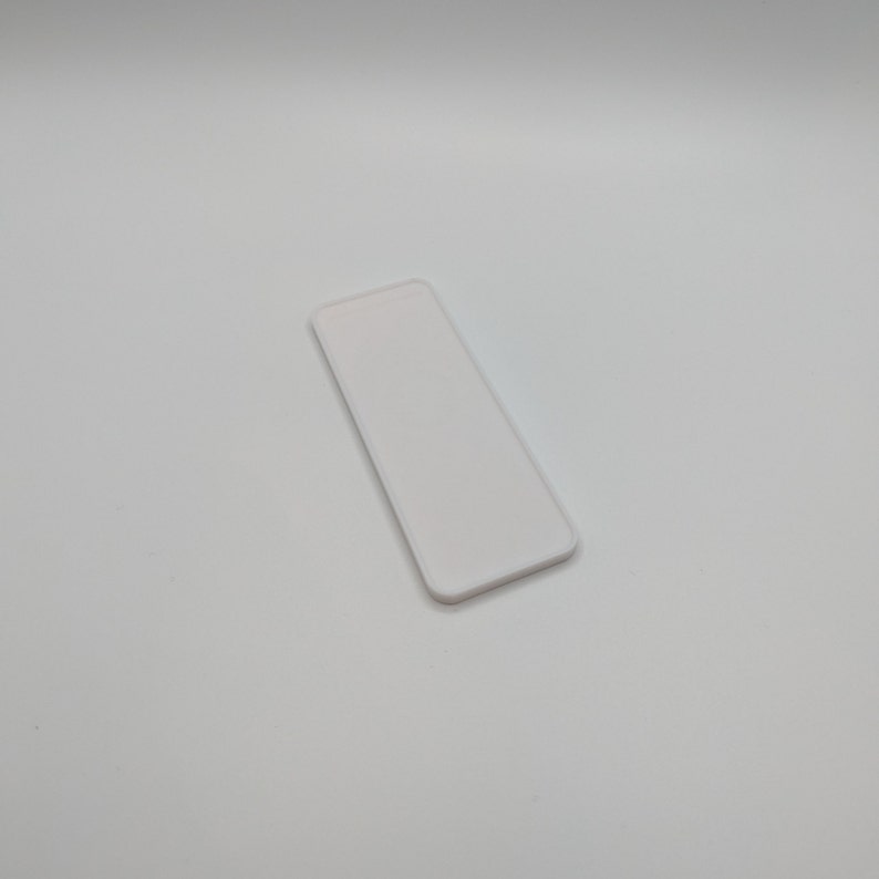 Invisible holder for the Philips Hue Dimmer Switch v2. Magnetic holder for the dimmer, fastened using NanoTape. image 6