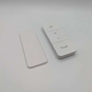 Invisible holder for the Philips Hue Dimmer Switch v2. Magnetic holder for the dimmer, fastened using NanoTape. image 3