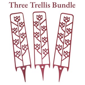 May include: Three burgundy metal trellis bundle. Each trellis features a floral design with a pointed stake for easy garden placement. The text "Three Trellis Bundle" is at the top of the image.