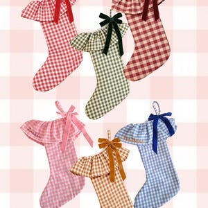 May include: Six Christmas stockings in various gingham patterns, each featuring a ruffled top and a velvet bow. The stockings are red, green, pink, brown, and blue. The text "PERSONALISED STOCKINGS" and "@chateaumathilde" are visible.