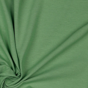 May include: A close-up of a green ribbed fabric. The fabric is soft and has a subtle texture.