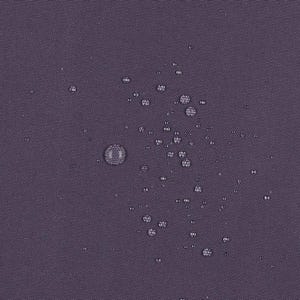 May include: A dark purple fabric surface with a visible woven texture, featuring numerous small, clear water droplets scattered across the material, demonstrating a water-repellent quality on the solid-colored textile.
