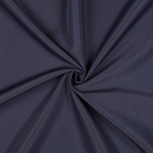 May include: A solid dark charcoal gray fabric with a smooth, matte texture. The material is gathered in the center, creating deep, radiating folds and shadows that highlight the consistent color and fine weave of the textile surface.