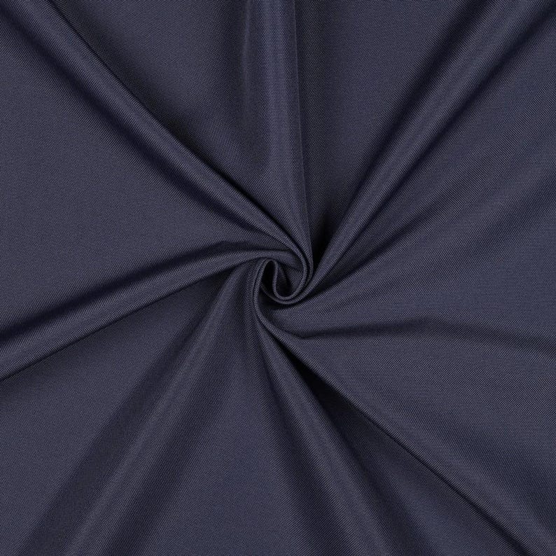 May include: A solid dark charcoal gray fabric with a smooth, matte texture. The material is gathered in the center, creating deep, radiating folds and shadows that highlight the consistent color and fine weave of the textile surface.