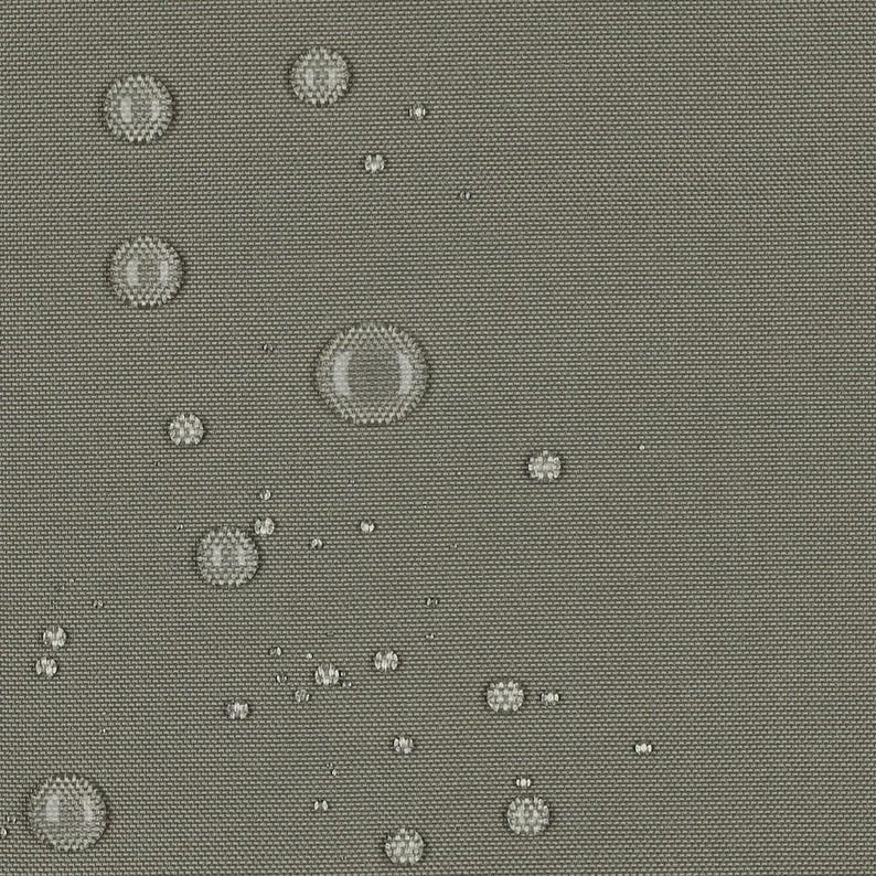 May include: A close-up view of a solid, neutral gray fabric with a visible woven texture. Numerous clear water droplets of varying sizes are scattered across the surface, creating a beaded effect on the water-resistant material.